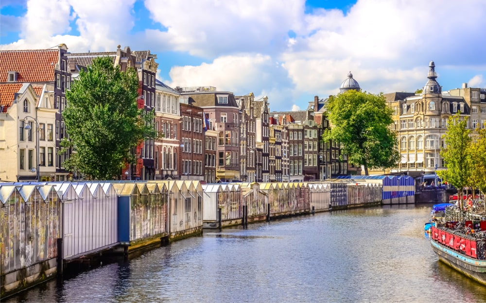 Scenic view of canal in Amsterdam at flower market